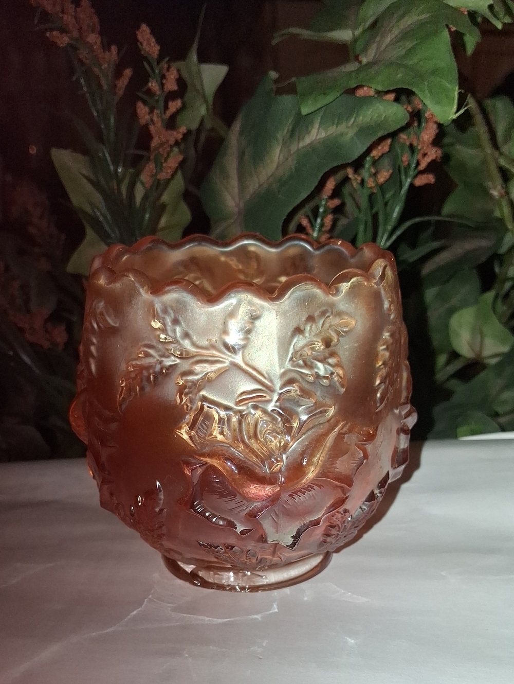 item is a Dugan Marigold Carnival Glass Rose Bowl in the "Wreath of Roses"